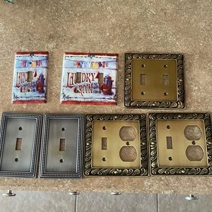 7 decorative Wall Plate Covers. 2 Pewter, 3 brass, 2 for Laundry Room